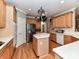 Bright kitchen with center island, double oven, and stainless steel refrigerator at 7012 Chadwyck Farms Dr, Charlotte, NC 28226