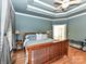 Bright main bedroom with hardwood floors, tray ceiling, and ample natural light from the large window at 7012 Chadwyck Farms Dr, Charlotte, NC 28226