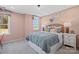 Stylish bedroom featuring a comfortable bed, decorative pillows, and ample natural light at 7105 Short Stirrup Ln, Mint Hill, NC 28227