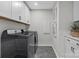 Well-equipped laundry room with modern washer and dryer and ample storage space at 7105 Short Stirrup Ln, Mint Hill, NC 28227
