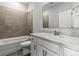 Bathroom features modern fixtures, tiled shower and tub combination, and white vanity with ample counter space at 7117 Brookview Ln, Sherrills Ford, NC 28673
