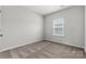 This bedroom offers neutral carpet and a window at 7117 Brookview Ln, Sherrills Ford, NC 28673