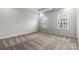This bedroom offers neutral carpet and two windows at 7117 Brookview Ln, Sherrills Ford, NC 28673