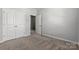 Spacious bedroom featuring a closet and neutral walls with plush carpet for comfort at 7117 Brookview Ln, Sherrills Ford, NC 28673