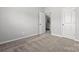 Neutral bedroom featuring carpeted floors and access to an ensuite bathroom for added convenience at 7117 Brookview Ln, Sherrills Ford, NC 28673