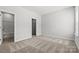 Neutral bedroom featuring carpeted floors with views of an adjacent bathroom at 7117 Brookview Ln, Sherrills Ford, NC 28673