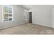 Bedroom featuring carpeted floors, two windows and neutral walls at 7117 Brookview Ln, Sherrills Ford, NC 28673
