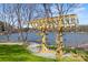 Wooden structure on lakeside offers a unique storage solution or shaded area by the water's edge at 7117 Brookview Ln, Sherrills Ford, NC 28673