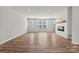 Bright living room with a modern fireplace, hardwood floors and large windows at 7117 Brookview Ln, Sherrills Ford, NC 28673