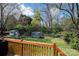 Fenced backyard featuring a wooden deck, green grass and a storage shed at 713 8Th Street Nw Dr, Hickory, NC 28601
