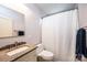 Clean bathroom featuring a granite vanity, modern fixtures, and a shower with a neutral curtain at 713 8Th Street Nw Dr, Hickory, NC 28601