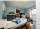 Cluttered bedroom with a twin bed, pile of laundry and boxes at 713 8Th Street Nw Dr, Hickory, NC 28601