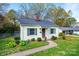 Inviting single-story home with manicured landscaping and a welcoming walkway at 713 8Th Street Nw Dr, Hickory, NC 28601