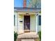 Close-up of front door with 'hello' mat on a covered porch at 713 8Th Street Nw Dr, Hickory, NC 28601
