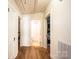 Hallway with wood floors leading to a bathroom at 713 8Th Street Nw Dr, Hickory, NC 28601