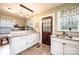Bright kitchen with granite countertops, white cabinets, and a classic style for culinary enthusiasts at 713 8Th Street Nw Dr, Hickory, NC 28601