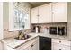The kitchen boasts granite countertops and white cabinets at 713 8Th Street Nw Dr, Hickory, NC 28601