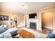 Cozy living room featuring a fireplace, television, and comfortable seating at 713 8Th Street Nw Dr, Hickory, NC 28601