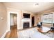 Comfortable living room with a fireplace, hardwood floors, and ample seating at 713 8Th Street Nw Dr, Hickory, NC 28601