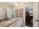 Bathroom featuring a double vanity with granite countertops, mirrors, and a doorway at 727 Bluff Loop Rd, Rock Hill, SC 29730