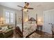 Cozy bedroom features a four-poster bed, hardwood floors, and a comfortable armchair at 727 Bluff Loop Rd, Rock Hill, SC 29730