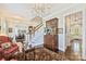Bright foyer showcasing hardwood floors, staircase, and decorative furniture for an elegant first impression at 727 Bluff Loop Rd, Rock Hill, SC 29730