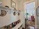 Welcoming hallway features storage bench with hat racks and decor at 727 Bluff Loop Rd, Rock Hill, SC 29730