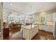 Modern kitchen with an island, white cabinetry, and stainless steel appliances perfect for cooking and entertaining at 727 Bluff Loop Rd, Rock Hill, SC 29730