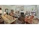 Spacious living room featuring a fireplace, bookshelves, and comfortable seating creating an inviting atmosphere at 727 Bluff Loop Rd, Rock Hill, SC 29730