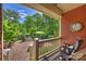 Covered patio features a seating area with a lovely view of the professionally landscaped backyard at 727 Bluff Loop Rd, Rock Hill, SC 29730