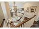 Open staircase with chandelier and gallery wall provides a view of the home's entry at 727 Bluff Loop Rd, Rock Hill, SC 29730