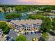 Scenic aerial shot of lake community's exterior, parking, and boat access at 7829 Village Harbor Dr, Cornelius, NC 28031