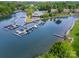Stunning aerial view of a lake community with boat docks and a restaurant at 7829 Village Harbor Dr, Cornelius, NC 28031