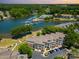 Picturesque aerial view of the community, lake, and surrounding lush landscape at 7829 Village Harbor Dr, Cornelius, NC 28031