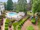 Aerial view of the community pool, showcasing the pool, deck, and surrounding landscaping at 7829 Village Harbor Dr, Cornelius, NC 28031