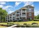Beautiful brick and siding exterior featuring a series of private balconies at 7829 Village Harbor Dr, Cornelius, NC 28031