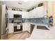 Modern kitchen with white cabinetry, stainless steel appliances, and sleek countertops at 7829 Village Harbor Dr, Cornelius, NC 28031