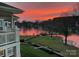 Beautiful lake view with a stunning sunset from a balcony of this home at 7829 Village Harbor Dr, Cornelius, NC 28031