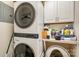Convenient laundry room featuring a washer, dryer, and storage space at 7829 Village Harbor Dr, Cornelius, NC 28031