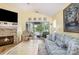 Comfortable living room with a stone fireplace and glass doors to the deck at 7829 Village Harbor Dr, Cornelius, NC 28031