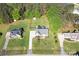 An aerial view of a home with a lush green lawn, mature trees, and well-maintained landscaping at 921 Snow Prince Ln, York, SC 29745