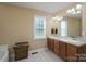 Bathroom with dual sinks, vanity, and a large mirror for plenty of light and space at 921 Snow Prince Ln, York, SC 29745