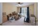 Bedroom with a ceiling fan and a large window; currently being used for storage at 921 Snow Prince Ln, York, SC 29745