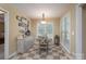 Cozy breakfast nook features a round table, stylish buffet, and bright natural light from the window at 921 Snow Prince Ln, York, SC 29745