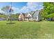 Traditional-style home boasts a well-manicured front yard, perfect for curb appeal at 921 Snow Prince Ln, York, SC 29745