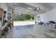 A clean and spacious garage with ample storage and an open door showcasing the backyard at 921 Snow Prince Ln, York, SC 29745