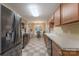 Efficient kitchen design with stainless steel appliances, ample cabinet space, and checkered flooring at 921 Snow Prince Ln, York, SC 29745