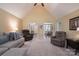 Bright living room with neutral walls, carpet, and furniture offering a comfortable space for relaxing and entertaining at 921 Snow Prince Ln, York, SC 29745