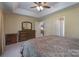Bright main bedroom featuring a trey ceiling, large dresser, and a view into the en suite bathroom at 921 Snow Prince Ln, York, SC 29745