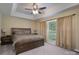 Spacious main bedroom with a trey ceiling, ceiling fan, and a large window for natural light at 921 Snow Prince Ln, York, SC 29745